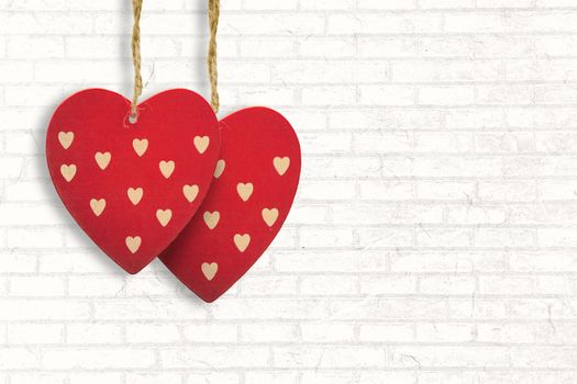 Cute heart decorations against white wall