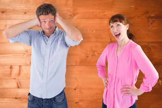 Woman arguing with ignoring man against overhead of wooden planks