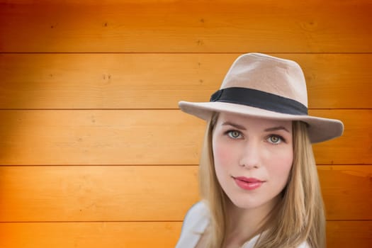 Pretty hipster blonde against wooden planks background