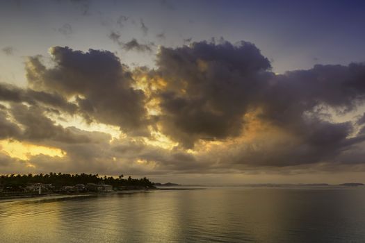 Early morning sun over a fishing village in the Philippines.