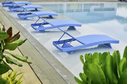 Turquoise pool benches in Philippine hotel