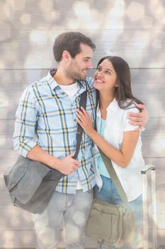 Attractive young couple going on their holidays against light glowing dots design pattern