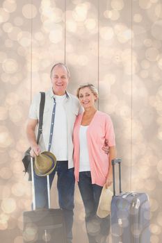 Smiling older couple going on their holidays against light glowing dots design pattern