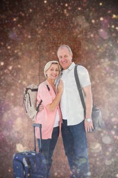 Smiling older couple going on their holidays against white snow and stars on black