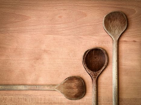 abstract kitchen background Three old wooden spoon