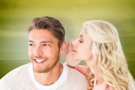 Attractive blonde whispering secret to boyfriend against wooden planks background