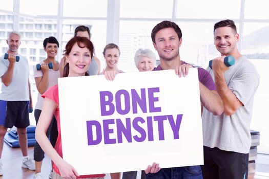 Couple holding a white sign against bone density