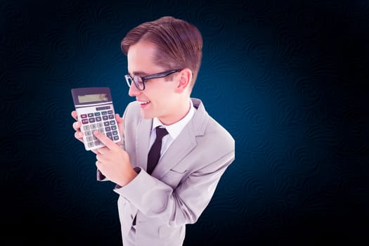 Geeky smiling businessman showing calculator against white background