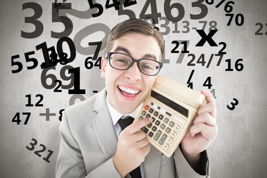 Geeky smiling businessman showing calculator against white background