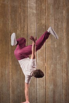 Cool break dancer against wooden planks background