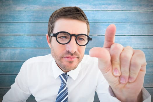 Businessman pointing with his finger against wooden planks