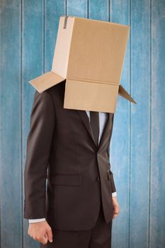 Anonymous businessman with hands down against wooden planks