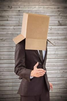 Anonymous businessman offering his hand against wooden planks background