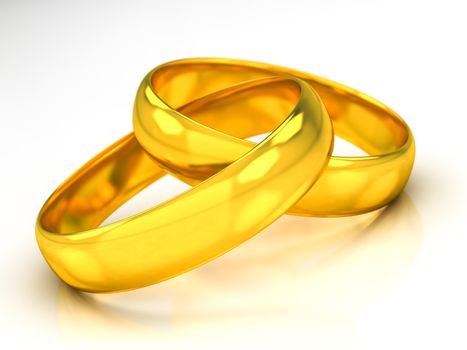 golden wedding rings on a white beckground