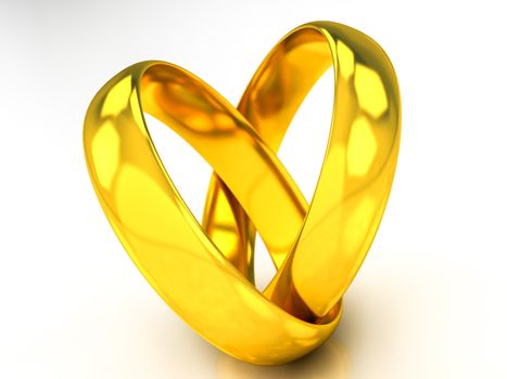 golden wedding rings on a white beckground