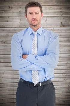 Businessman looking at the camera against wooden planks background