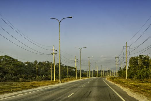 Sunrise over a newly built concrete road, Philippines