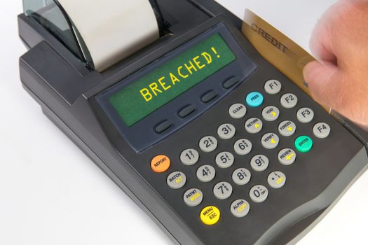 Debit/Credit terminal showing a person actively swiping a card and getting a response of "breached." Emphasis here is on the payment breaches occurring in the US and abroad