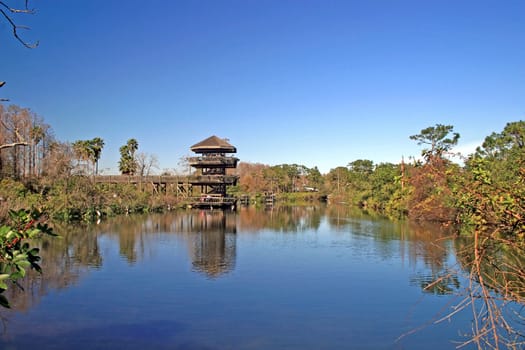 An Observation Tower overlooking a lake and trees