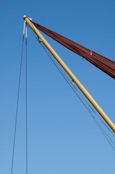 rigging abstract on a sailboat against a clear blue sky