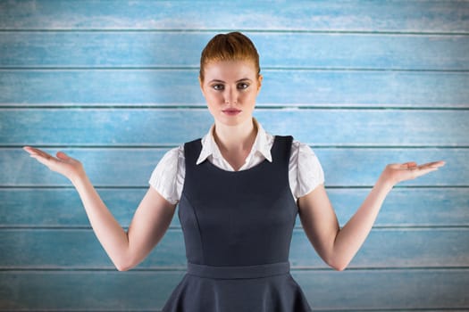 Businesswoman holding hands out in presentation against wooden planks