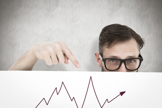 Geeky young hipster showing poster against white background