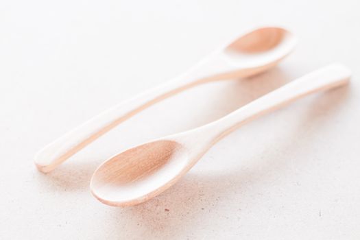 Wooden spoons on wooden background, stock photo