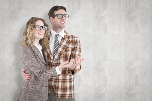 Geeky young hipster smiling at camera against white background