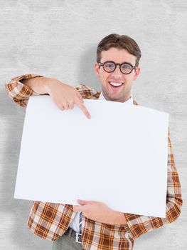 Geeky hipster smiling and showing card against white background