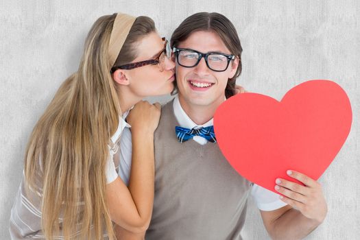 Smiling geeky hipster and his girlfriend  against white background