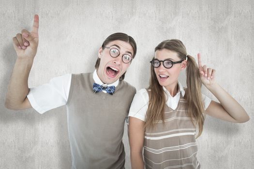 Geeky hipsters pointing against white background