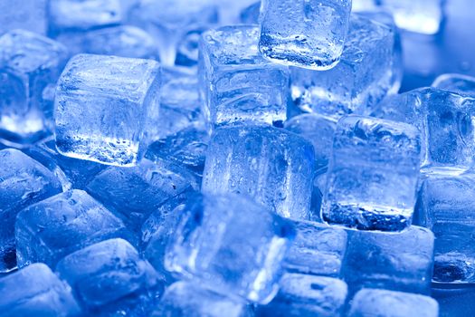 Ice cubes on blue background