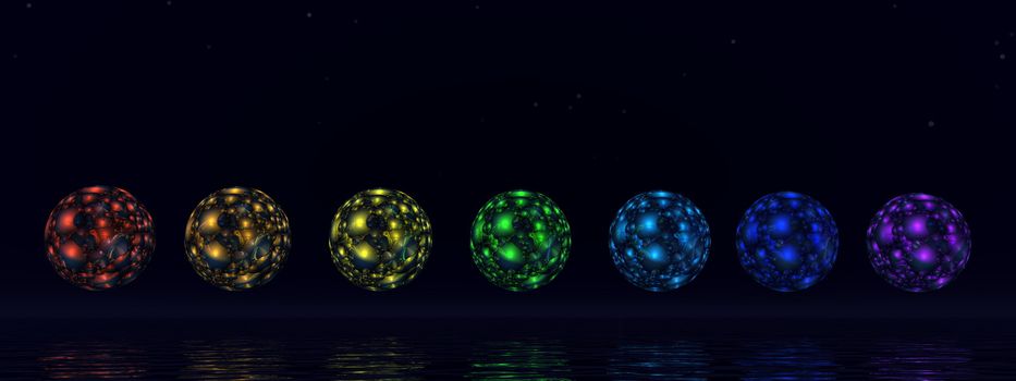 Colorful chakra spheres by night- 3D render