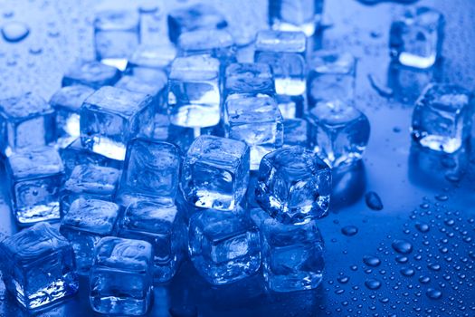 Ice cubes on blue background