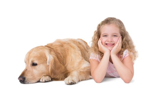 Little girl and dog lying on the floor on white background