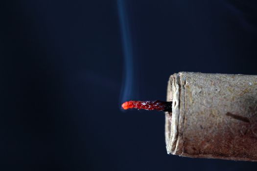 Burning fuse of a firecracker.