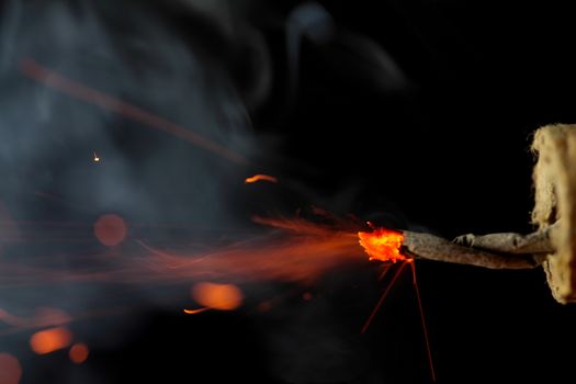 Burning fuse of a firecracker.