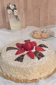 inviting cake with sponge cake and red strawberries