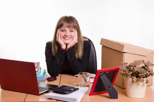 Cute business woman in the office at the computer