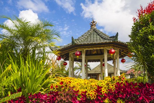 Azian Gazebo under Blue Sly and Beautiful Flowers