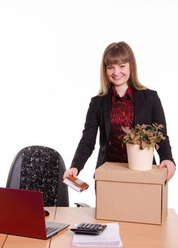 The girl accepted a job in an office holding a box with things