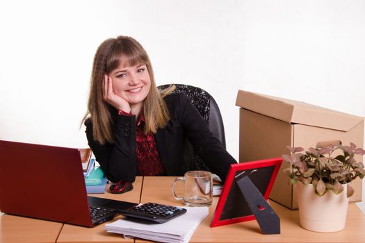 Cute business woman in the office at the computer