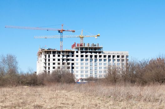 Construction site with cranes on sky background. Kaliningrad. Russia.