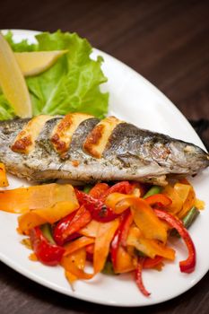 Tasty dish of rainbow trout fish with vegetables