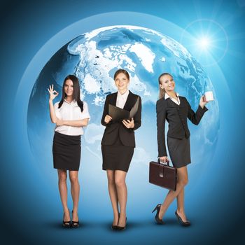 Business womens in suits, blouses, skirts, smiling and looking at camera. Against background of globe earth. Elements of this image furnished by NASA