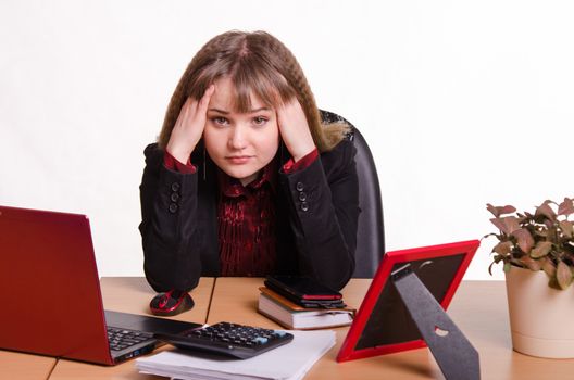 Cute business woman in the office at the computer