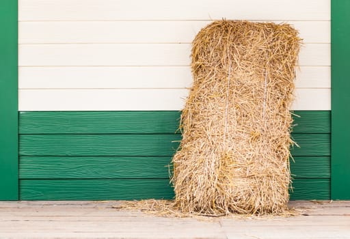 Dried Straw on Wood Wall.