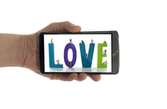 woman hand with making love text in phone