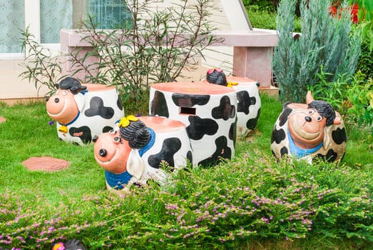 Cow Shaped Concrete Table and Chairs.