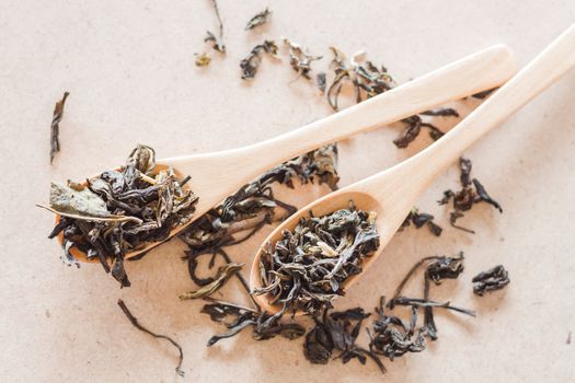 Closeup Oolong tea in wooden spoons, stock photo